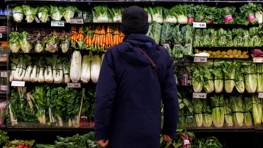 A customer shops in the produce section at a grocery store In Toronto, Feb. 2, 2024. THE CANADIAN PRESS/Cole Burston