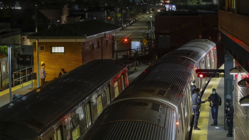 New York Police officers clear a train at the Coney Island Stillwell Avenue Terminal, May 5, 2020, in the Brooklyn borough of New York. (AP Photo/Frank Franklin II